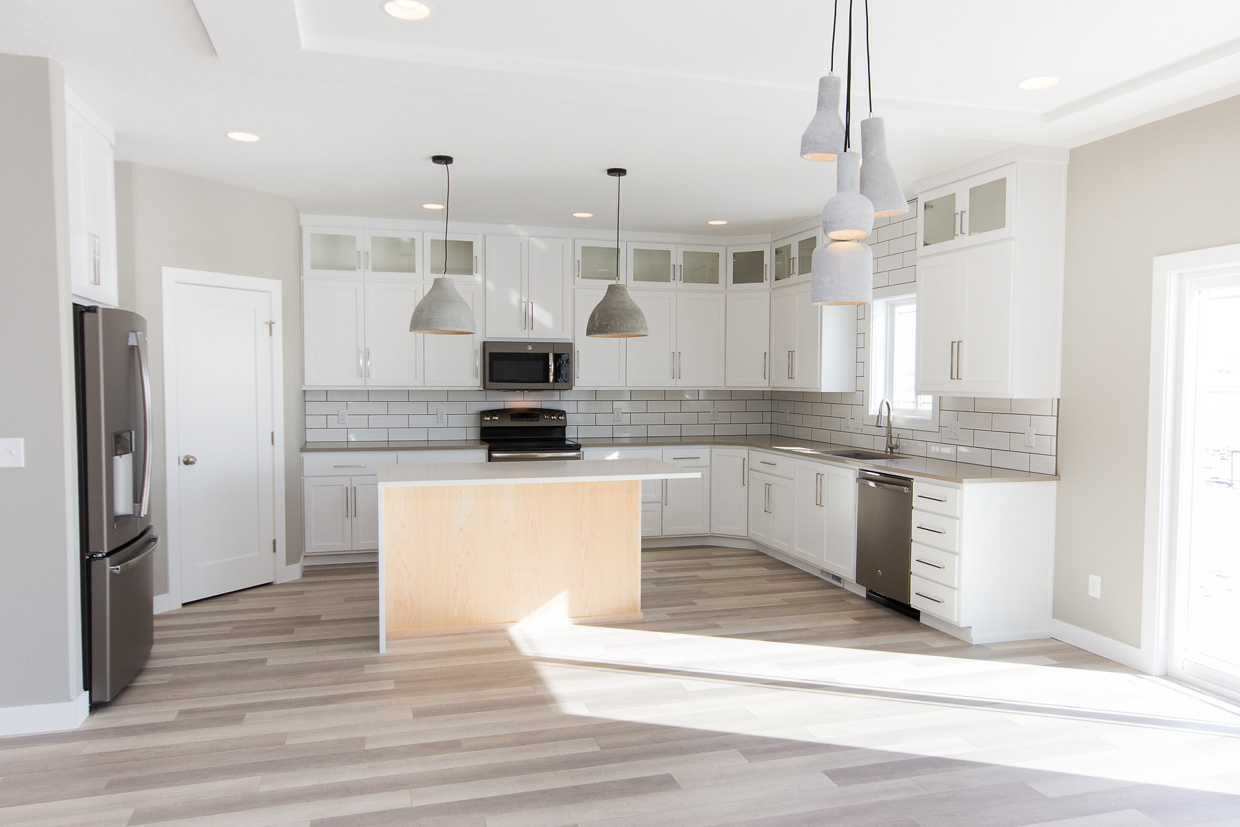 Sleek cabinets + concrete fixtures.jpg