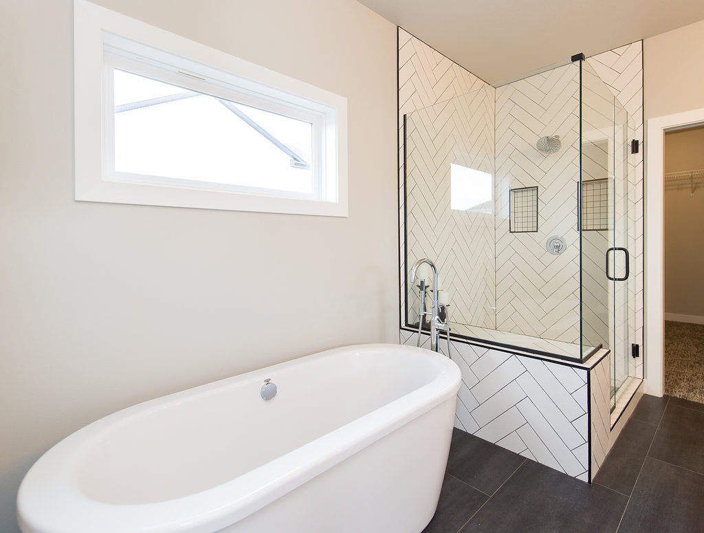 Soaker Tub, Natural Light, Herringbone TIle.jpg